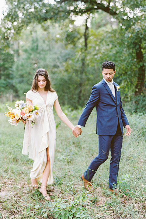  ruffled shoot in texas – bride in a romantic casual wrap dress and the groom in a blue suit with a white long tie