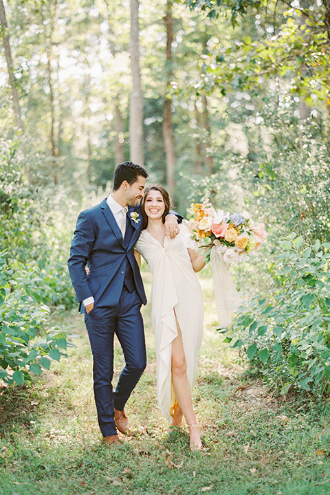  ruffled shoot in texas – bride in a romantic casual wrap dress and the groom in a white long tie