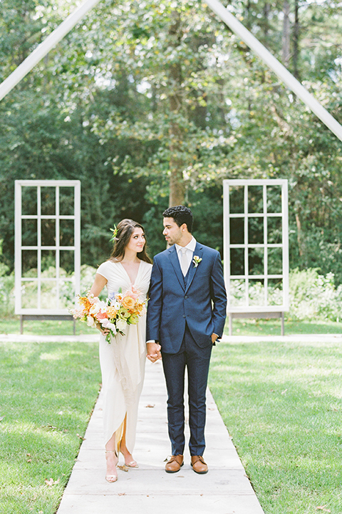  ruffled shoot in texas – bride in a romantic casual wrap dress and the groom in a white long tie