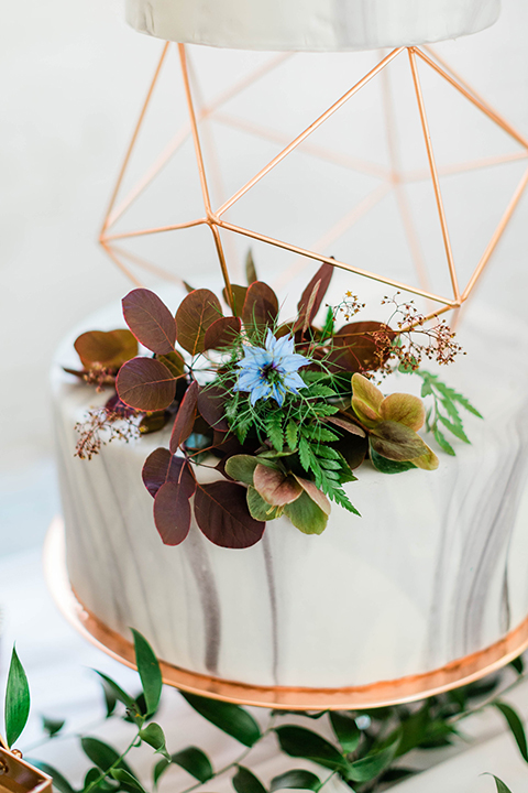  modern white and marble design cake with gold details 
