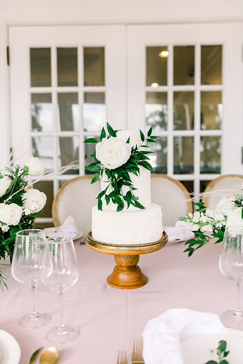  white bridal cake with green and white flowers