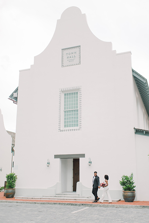  alys beach anniversary shoot with the groom in a burgundy velvet tuxedo and the bride in a jumpsuit 