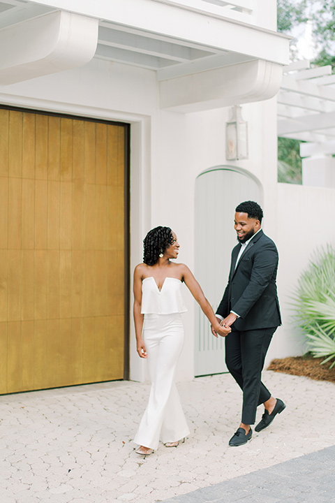  alys beach anniversary shoot with the groom in a burgundy velvet tuxedo and the bride in a jumpsuit 