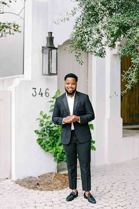  alys beach anniversary shoot with the groom in a burgundy velvet tuxedo and the bride in a jumpsuit 