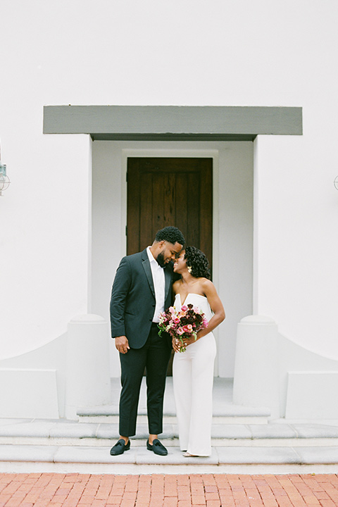  alys beach anniversary shoot with the groom in a burgundy velvet tuxedo and the bride in a jumpsuit 