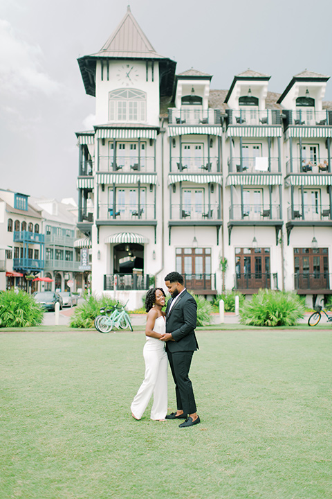  alys beach anniversary shoot with the groom in a burgundy velvet tuxedo and the bride in a jumpsuit 