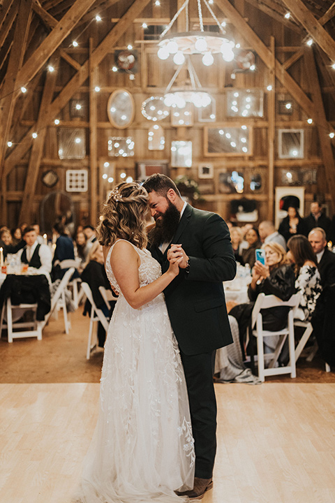  bride in a modern boho gown and the groom and groomsmen in green suits and the bridesmaids in blush gowns 