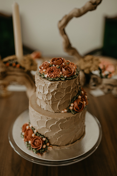  wedding at the colony house with bohemian touches and the groom in a rose pink suit and wide brimmed hat