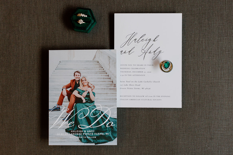  bride in a trumpet style gown and the groom in a green suit, the groomsmen in caramel notch lapel suits and the bridesmaids in ivory gowns 