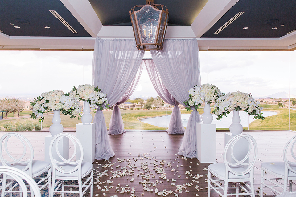  Las Vegas wedding with purple details and the bride in a strapless gown and the groom in a black velvet tuxedo 