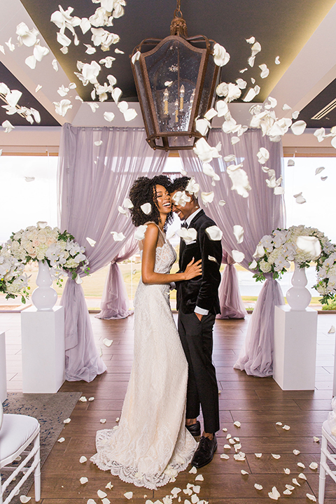  Las Vegas wedding with purple details and the bride in a strapless gown and the groom in a black velvet tuxedo 