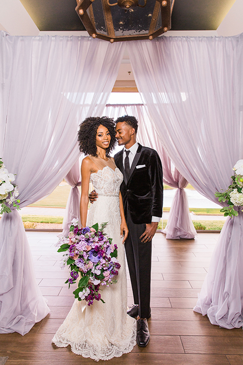  Las Vegas wedding with purple details and the bride in a strapless gown and the groom in a black velvet tuxedo 