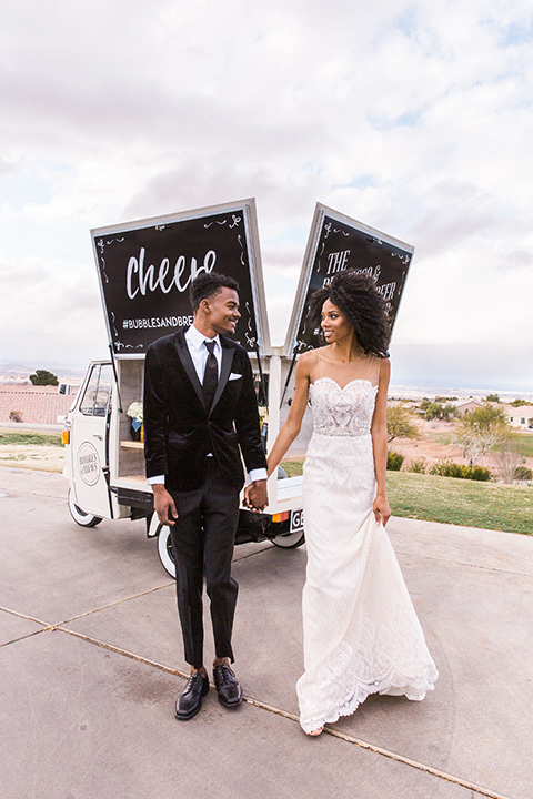  Las Vegas wedding with purple details and the bride in a strapless gown and the groom in a black velvet tuxedo 