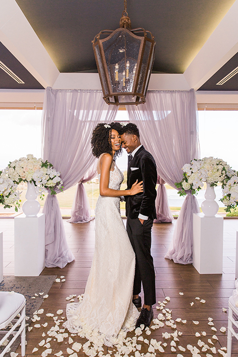  Las Vegas wedding with purple details and the bride in a strapless gown and the groom in a black velvet tuxedo 