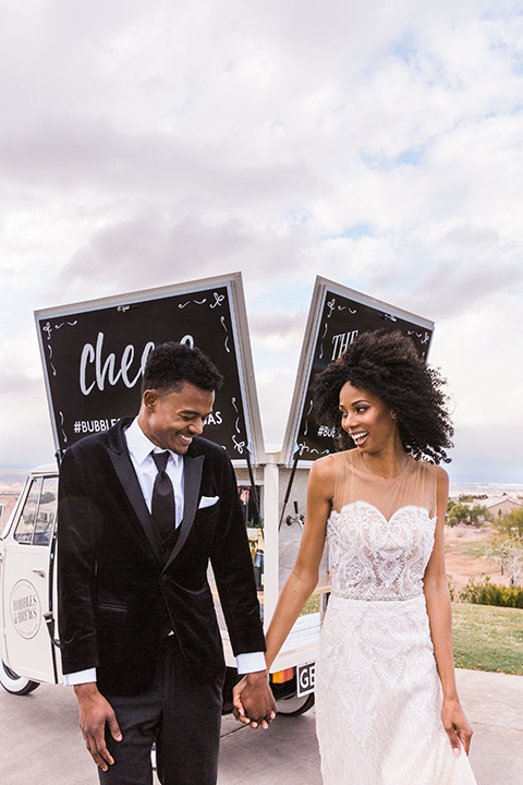 Las Vegas wedding with purple details and the bride in a strapless gown and the groom in a black velvet tuxedo 