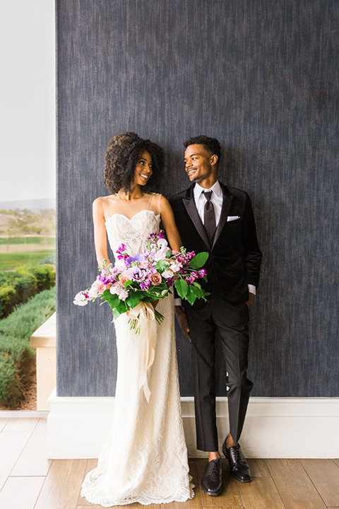  Las Vegas wedding with purple details and the bride in a strapless gown and the groom in a black velvet tuxedo 