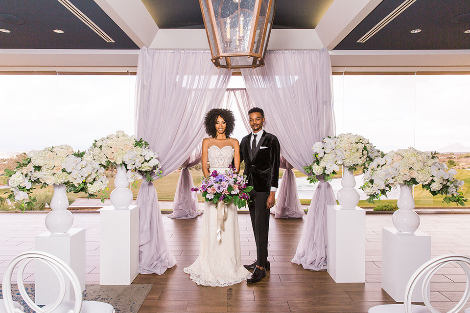  Las Vegas wedding with purple details and the bride in a strapless gown and the groom in a black velvet tuxedo 