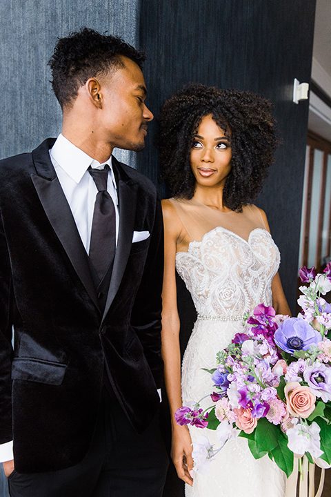  Las Vegas wedding with purple details and the bride in a strapless gown and the groom in a black velvet tuxedo 