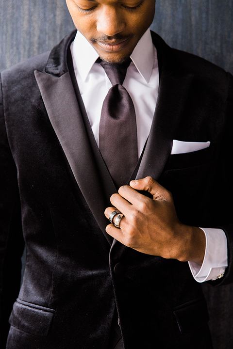  Las Vegas wedding with purple details and the bride in a strapless gown and the groom in a black velvet tuxedo 