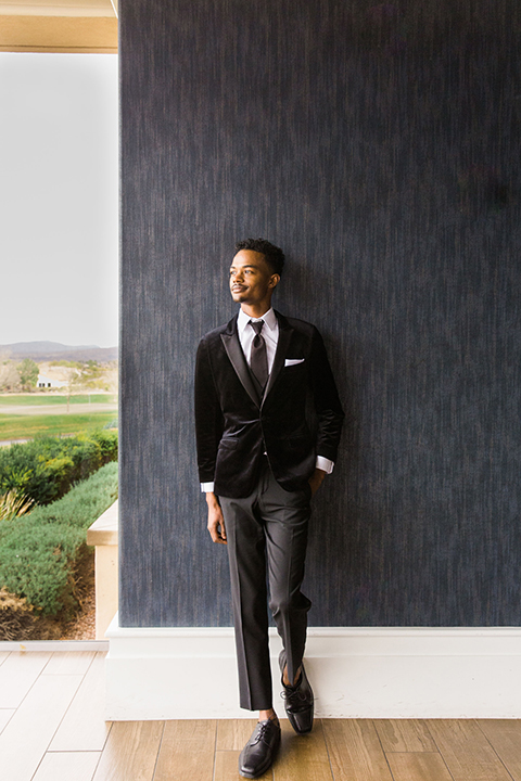  Las Vegas wedding with purple details and the bride in a strapless gown and the groom in a black velvet tuxedo 