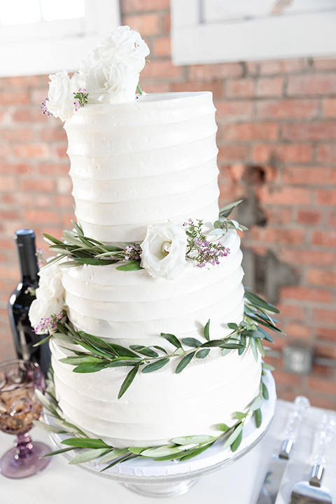  San Diego wedding with purple and grey touches and the groom in a light grey suit 