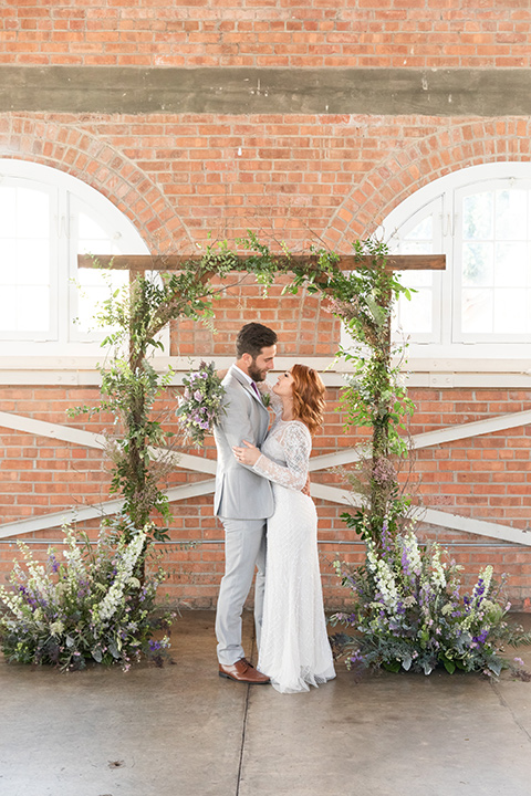  San Diego wedding with purple and grey touches and the groom in a light grey suit 