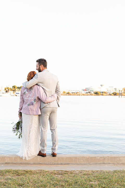  San Diego wedding with purple and grey touches and the groom in a light grey suit 