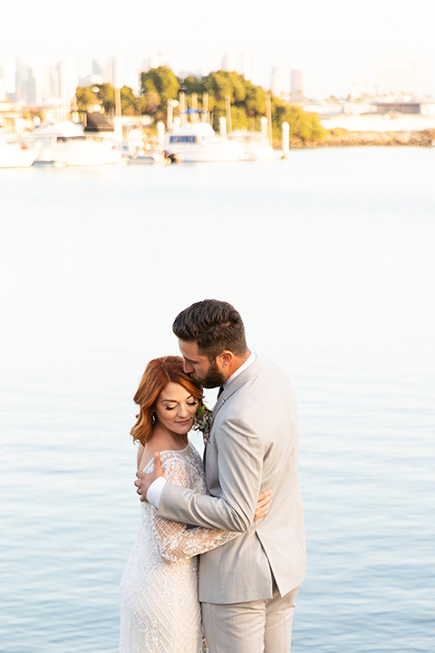  San Diego wedding with purple and grey touches and the groom in a light grey suit 