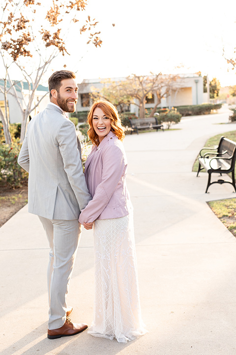  San Diego wedding with purple and grey touches and the groom in a light grey suit 