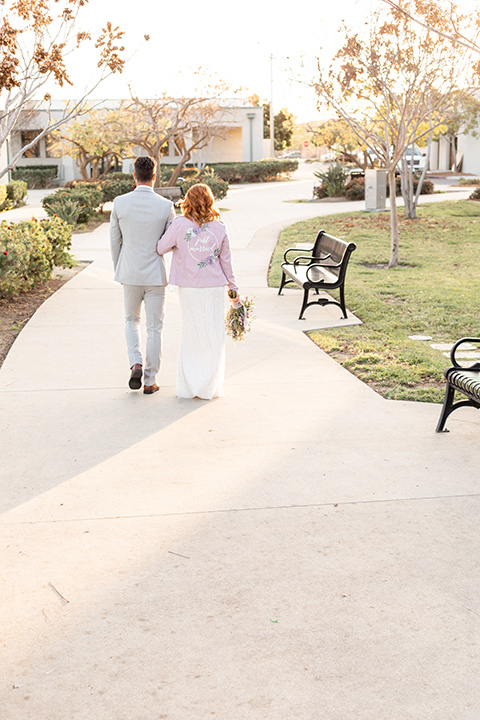  San Diego wedding with purple and grey touches and the groom in a light grey suit 