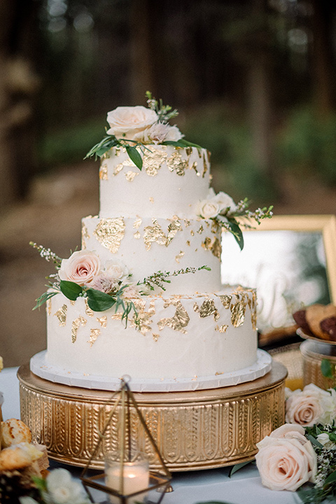  garden themed wedding with the bride in a light lilac colored gown and the groom in a navy suit with lots of wedding day flowers