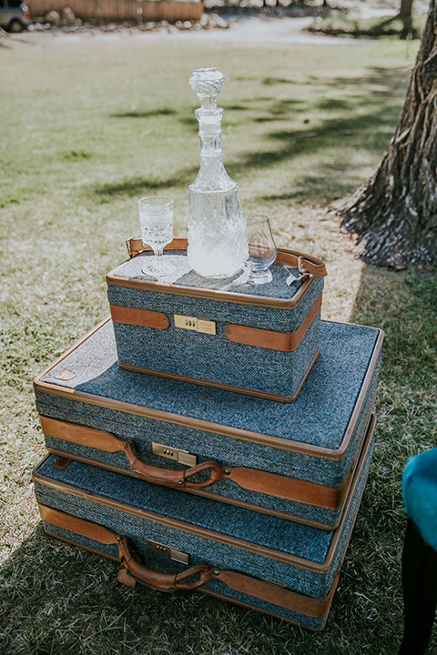  bohemian wedding at a fish hatchery and the bride in a rue de sine gown and the groom in a light grey suit 