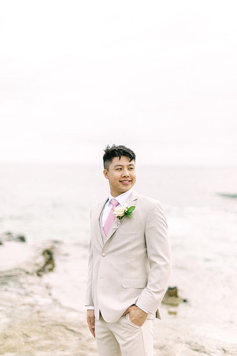  a coastal beach theme with a blush and beige wedding color scheme – groom 