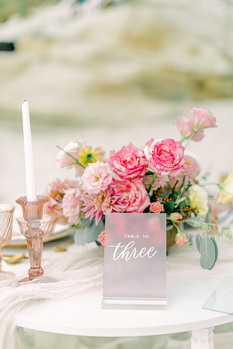  a coastal beach theme with a blush and beige wedding color scheme – table décor and flatware in pink and white colors 