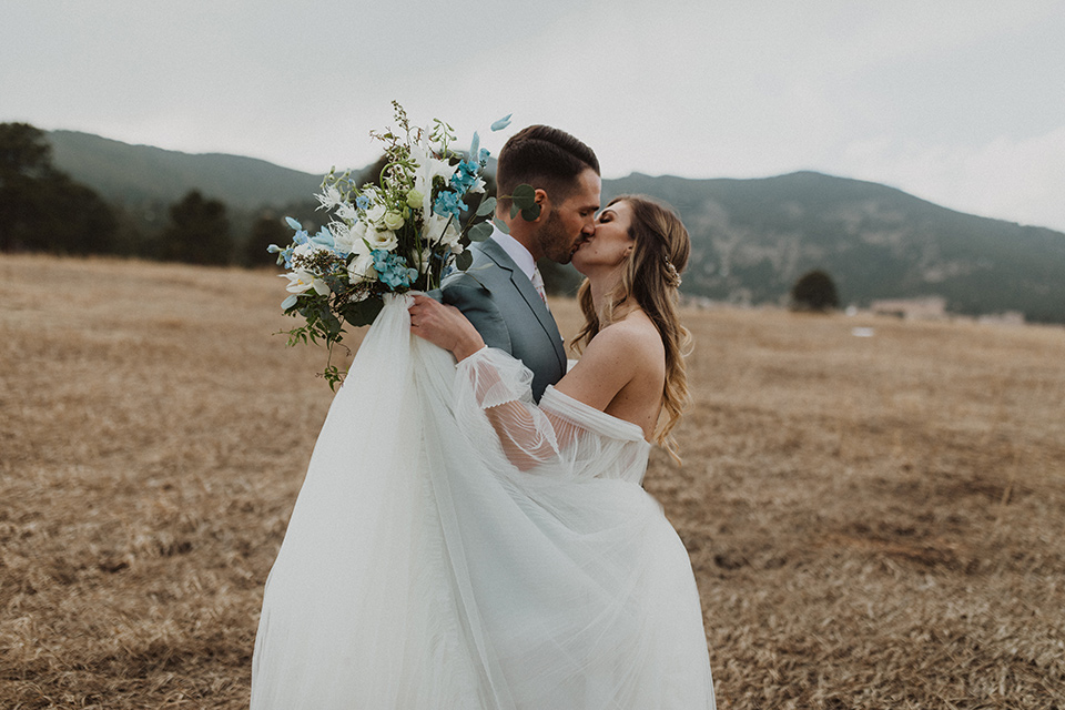  couple laughing at their elopement in a meadow in Colorado 