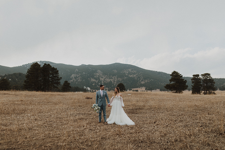  couple laughing at their elopement in a meadow in Colorado 