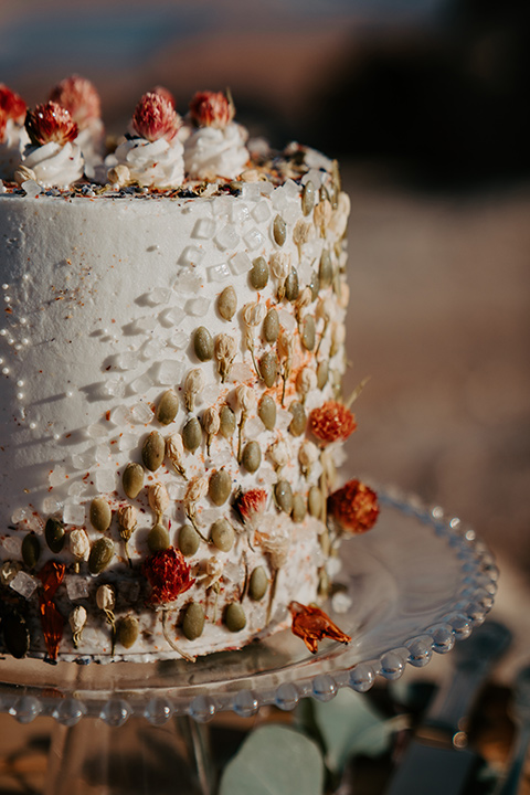  a boho wedding at lake powell with the bride in a bohemian gown and a wide brimmed hat and the groom in a gold velvet jacket – dessert and cake