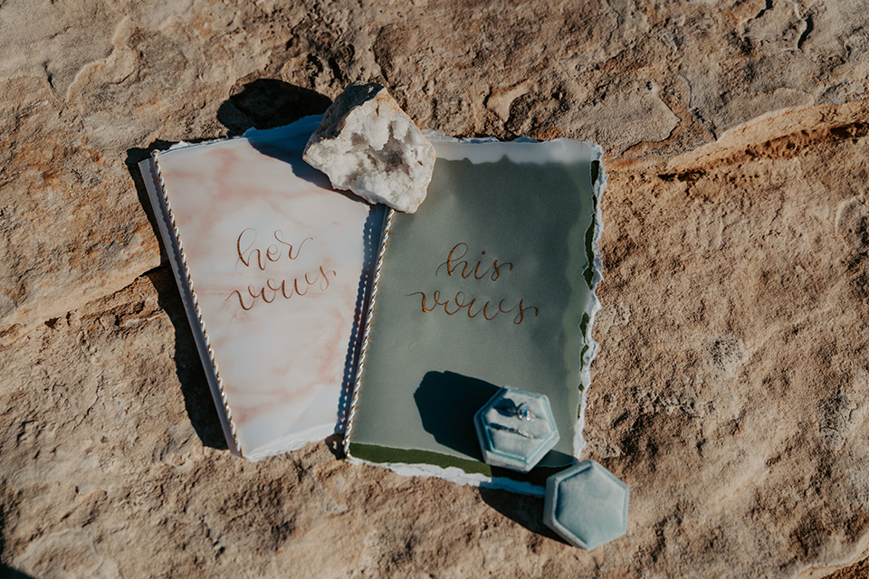  a boho wedding at lake powell with the bride in a bohemian gown and a wide brimmed hat and the groom in a gold velvet jacket – vow books